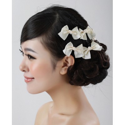http://www.orientmoon.com/11335-thickbox/white-bow-wedding-headpiece.jpg