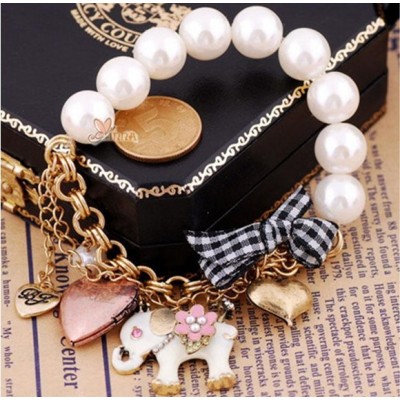 http://www.orientmoon.com/16084-thickbox/vintage-multielement-bracelet-with-pearl-elepahat-peach-heart-bowknot-pendants.jpg