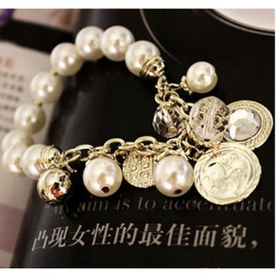 http://www.orientmoon.com/16113-thickbox/stylish-gold-diamond-pearl-bracelet-tb162.jpg