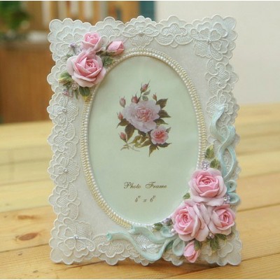 http://www.orientmoon.com/65128-thickbox/pink-rose-oval-photo-frame.jpg