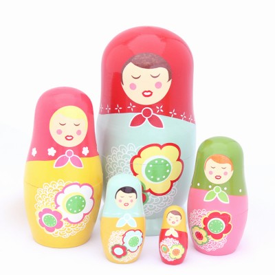 http://www.orientmoon.com/89960-thickbox/5pcs-russian-nesting-doll-handmade-wooden-cute-cartoon-yellow-girl-pattern.jpg